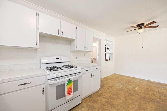 kitchen with white cabinetry, gas range gas stove, and ceiling fan