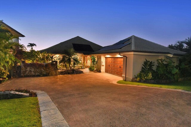 view of front of property with a garage