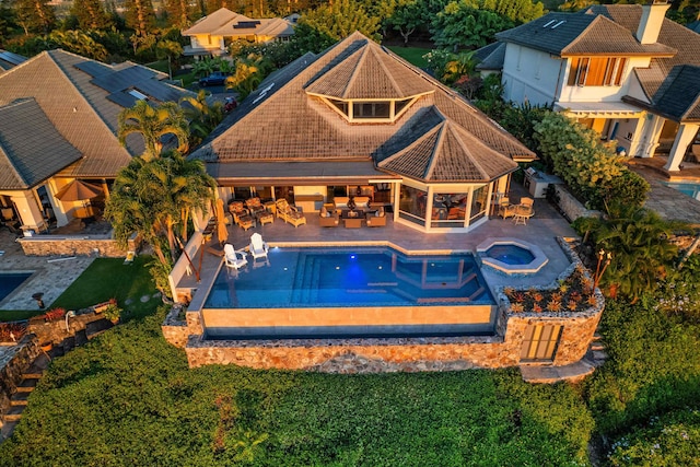 view of swimming pool with a gazebo, a patio area, and an in ground hot tub