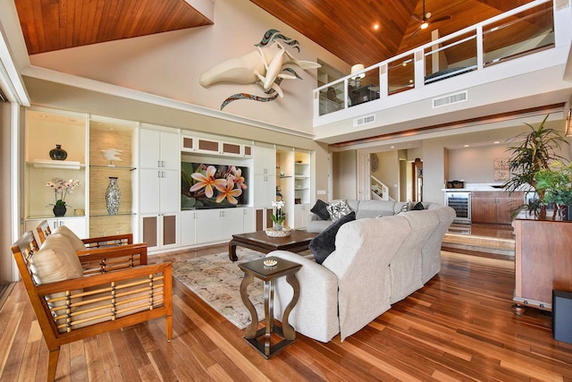 living room with built in features, wood-type flooring, high vaulted ceiling, and wooden ceiling