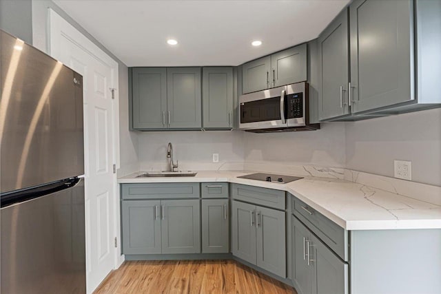 139 Mehani Pl, Kihei, HI 96753 - kitchen featuring a sink, gray cabinets, appliances with stainless steel finishes, and light wood-style floors