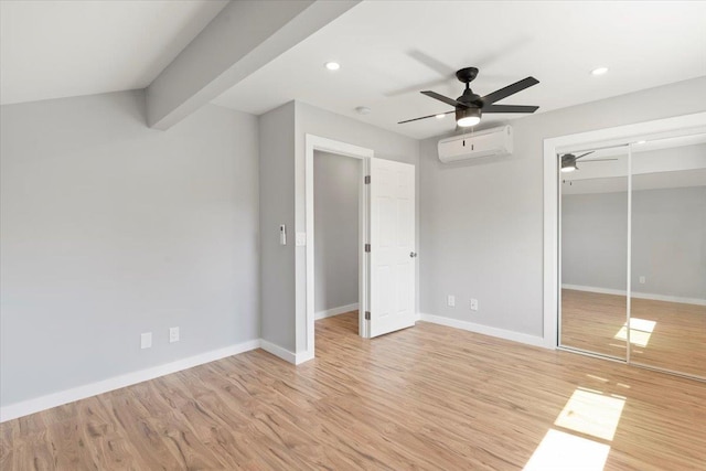 139 Mehani Pl, Kihei, HI 96753 - unfurnished bedroom featuring light wood-style floors, a closet, a wall mounted air conditioner, and baseboards