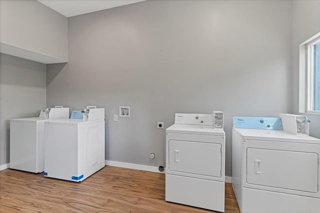 139 Mehani Pl, Kihei, HI 96753 - shared laundry area with light wood finished floors, independent washer and dryer, and baseboards