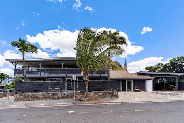 139 Mehani Pl, Kihei, HI 96753 - view of building exterior featuring driveway, fence, and an attached carport