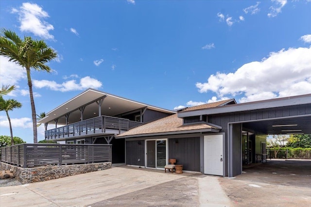 139 Mehani Pl, Kihei, HI 96753 - exterior space featuring roof with shingles, a balcony, driveway, and a carport