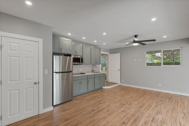 139 Mehani Pl, Kihei, HI 96753 - kitchen with a sink, gray cabinets, light wood-style flooring, and stainless steel appliances