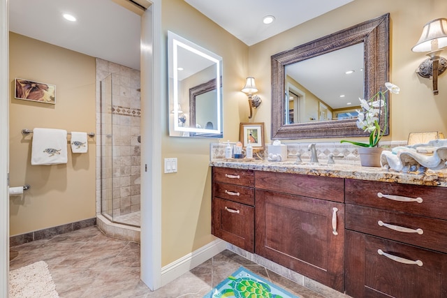 bathroom featuring vanity and an enclosed shower