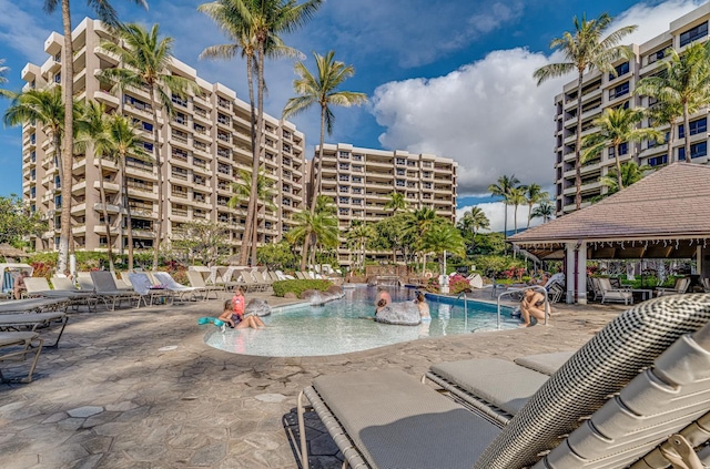 view of swimming pool featuring a patio area