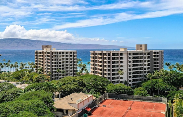 exterior space featuring a water and mountain view