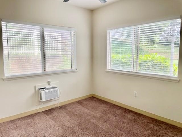 unfurnished room with carpet floors and ceiling fan