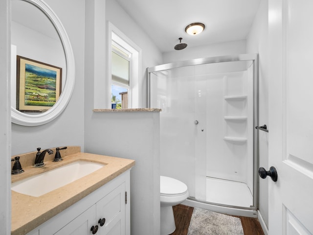 3100 Mapu Pl, Kihei, HI 96753 - bathroom with a stall shower, wood finished floors, and vanity