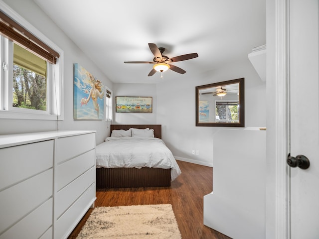3100 Mapu Pl, Kihei, HI 96753 - bedroom with multiple windows, dark wood-style flooring, and ceiling fan