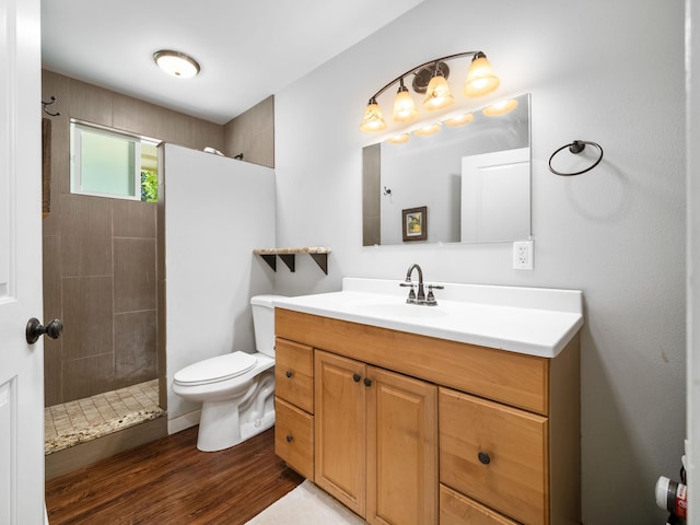 3100 Mapu Pl, Kihei, HI 96753 - bathroom featuring vanity, tiled shower, and wood finished floors