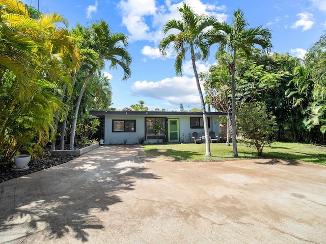 3100 Mapu Pl, Kihei, HI 96753 - view of front of house featuring a front lawn, driveway, and stucco siding