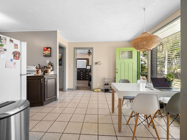 3100 Mapu Pl, Kihei, HI 96753 - dining room featuring ceiling fan, light tile patterned floors, and a textured ceiling