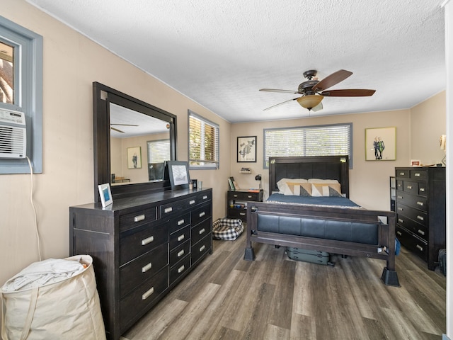 3100 Mapu Pl, Kihei, HI 96753 - bedroom featuring wood finished floors, a textured ceiling, and ceiling fan