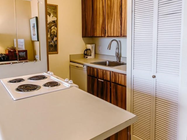 kitchen featuring sink and white appliances