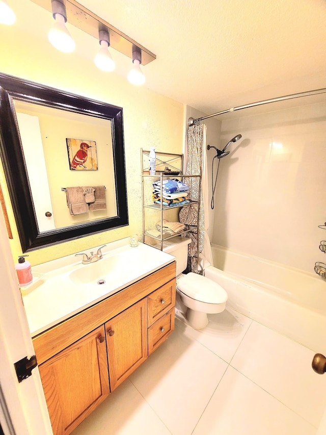 full bathroom featuring shower / bath combo with shower curtain, tile patterned floors, toilet, and vanity