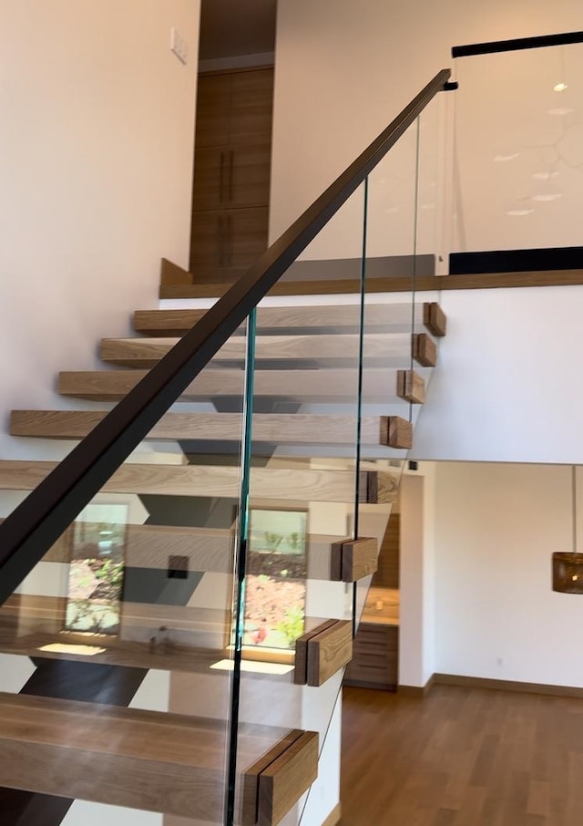 staircase featuring hardwood / wood-style flooring