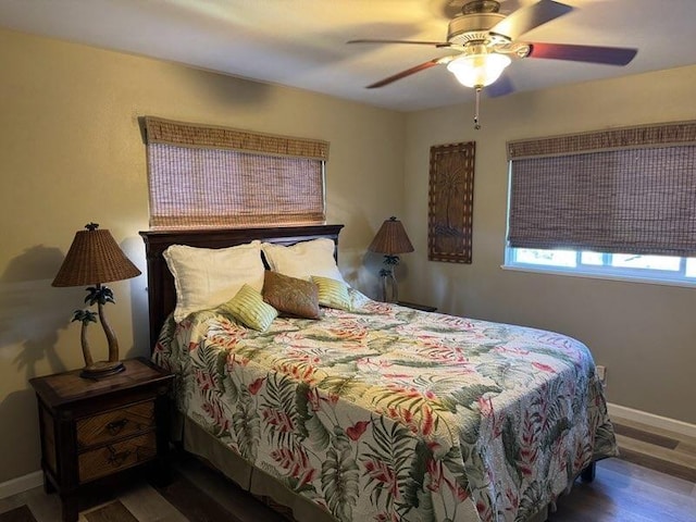 bedroom featuring hardwood / wood-style floors and ceiling fan