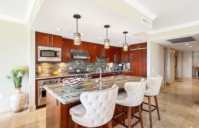 130 Kai Malina Pkwy Unit Nr202, Lahaina, HI 96761 - kitchen with appliances with stainless steel finishes, extractor fan, decorative backsplash, a breakfast bar, and recessed lighting