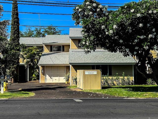 90 Auhana Rd Unit 202, Kihei, HI 96753 - view of front of home featuring asphalt driveway and roof with shingles