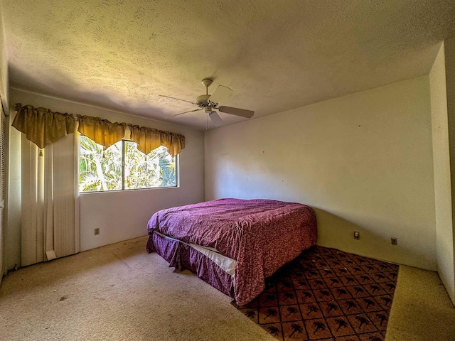 90 Auhana Rd Unit 202, Kihei, HI 96753 - bedroom featuring a textured ceiling, carpet, and a ceiling fan