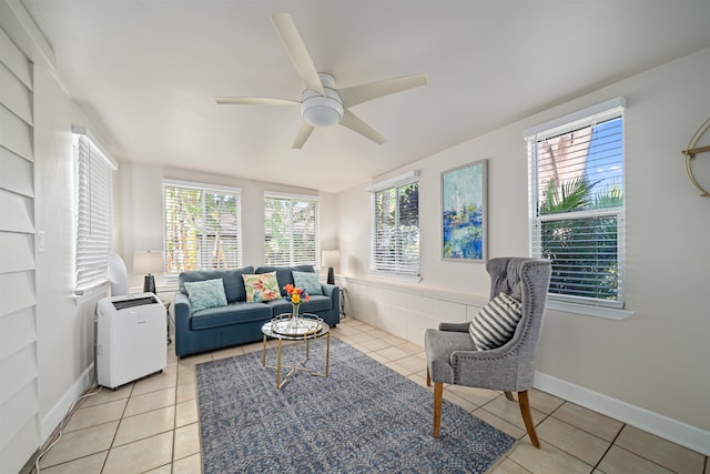 tiled living room featuring ceiling fan