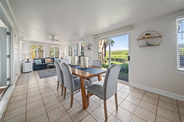 dining area with light tile flooring and ceiling fan