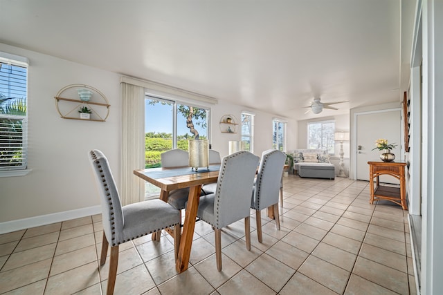 tiled dining room with ceiling fan