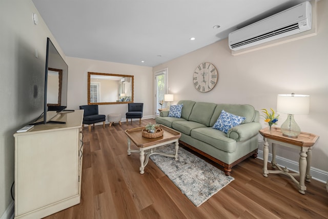 living room featuring hardwood / wood-style flooring and a wall mounted AC