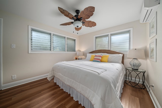 bedroom featuring a wall unit AC, ceiling fan, and dark hardwood / wood-style floors