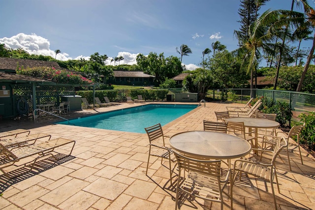 view of swimming pool with a patio area