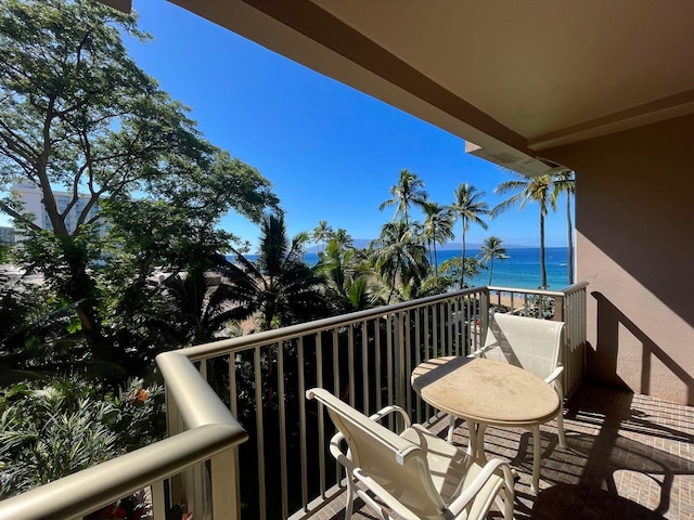 balcony featuring a water view