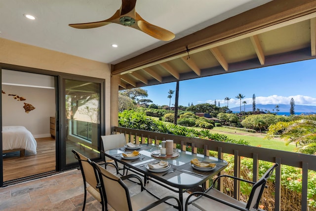 balcony featuring ceiling fan