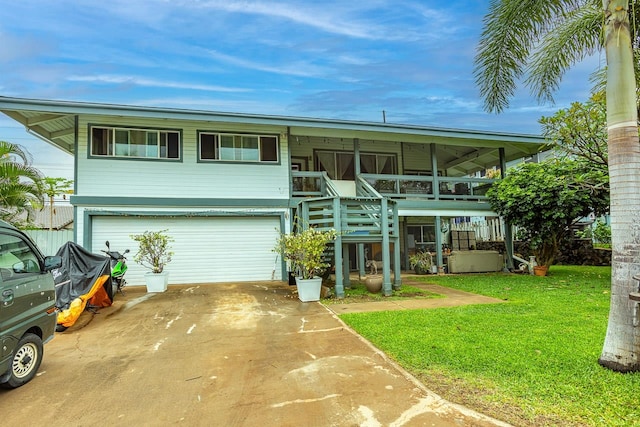 view of front facade with a garage and a front lawn