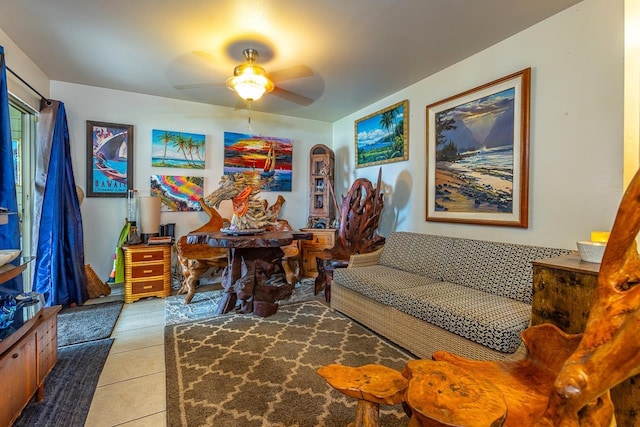 sitting room featuring light tile patterned flooring and ceiling fan