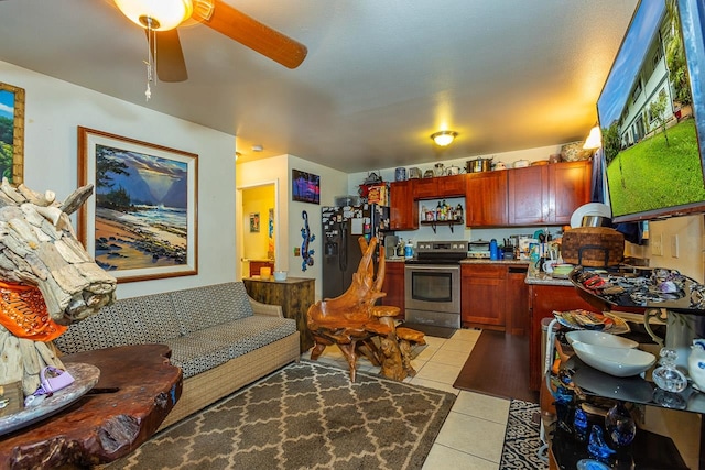 living room featuring light tile patterned flooring and ceiling fan