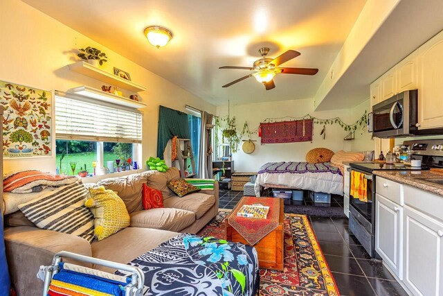 tiled bedroom featuring ceiling fan