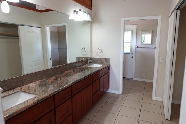 bathroom featuring tile patterned flooring and vanity