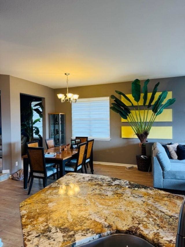 160 Kinohi Loa Loop, Wailuku, HI 96793 - dining space with a chandelier, wood finished floors, and baseboards