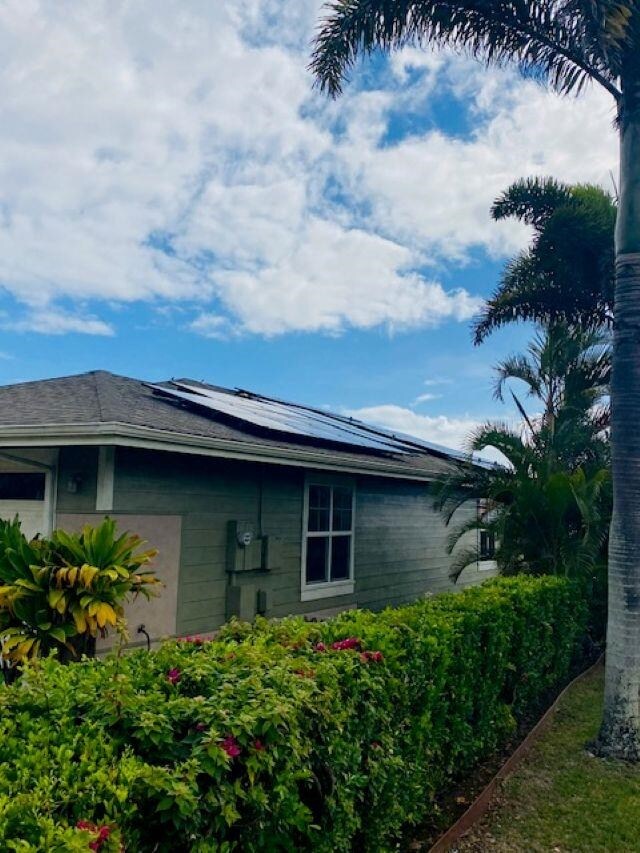 160 Kinohi Loa Loop, Wailuku, HI 96793 - view of home's exterior featuring solar panels and a garage