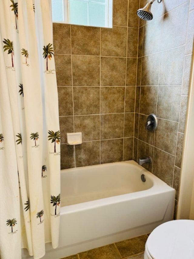 160 Kinohi Loa Loop, Wailuku, HI 96793 - bathroom with toilet, shower / bathtub combination with curtain, and tile patterned floors
