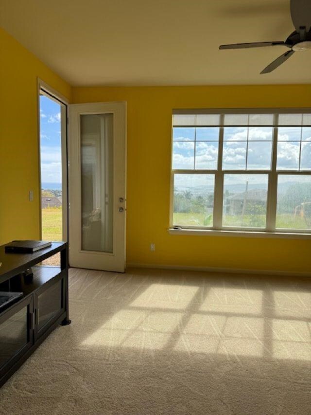 160 Kinohi Loa Loop, Wailuku, HI 96793 - empty room with light carpet and a ceiling fan