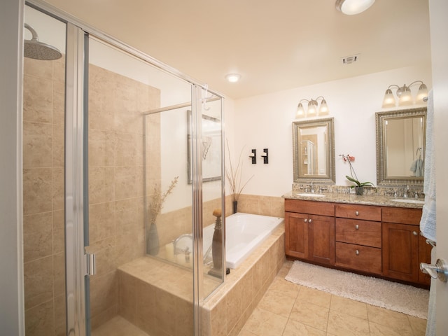 bathroom with tile patterned floors, vanity, and separate shower and tub