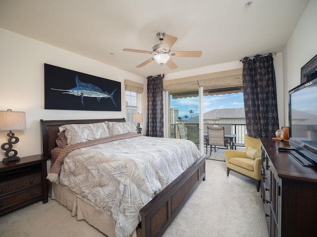 carpeted bedroom featuring access to outside, multiple windows, and ceiling fan