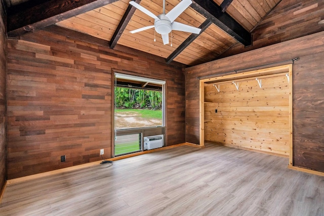 unfurnished room featuring vaulted ceiling with beams, wooden walls, hardwood / wood-style flooring, and wooden ceiling