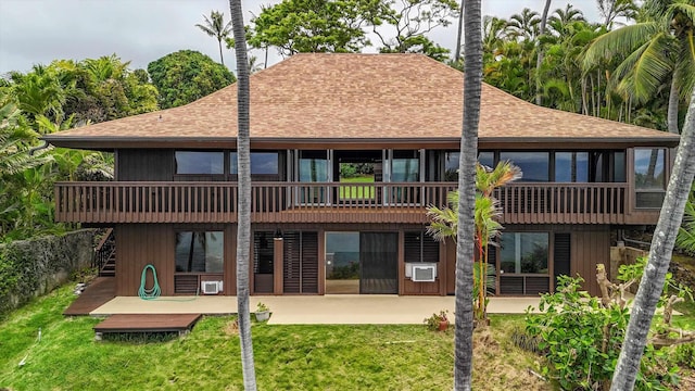 back of house featuring a deck, a yard, and a patio