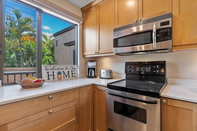 kitchen with stainless steel appliances and light countertops