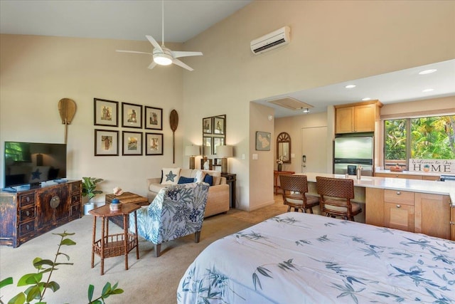 bedroom featuring recessed lighting, a towering ceiling, attic access, light carpet, and a wall mounted air conditioner